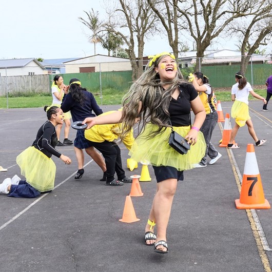 Young people laughing during a school activity image